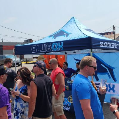 A group of people in front of the Blue Ox tent